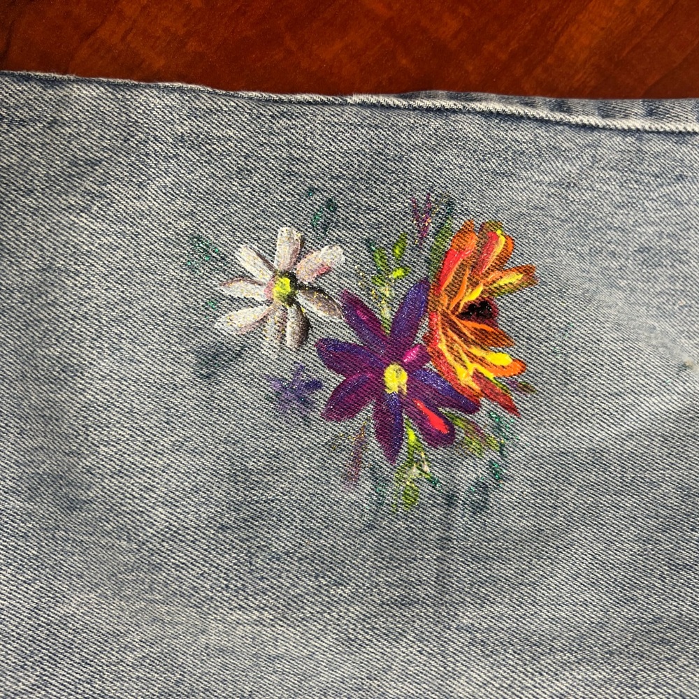 Vintage distressed Levi’s with hand painted design.